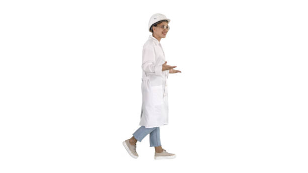 istock Woman engineer walkin and talking emotionaly on white background 1276818301