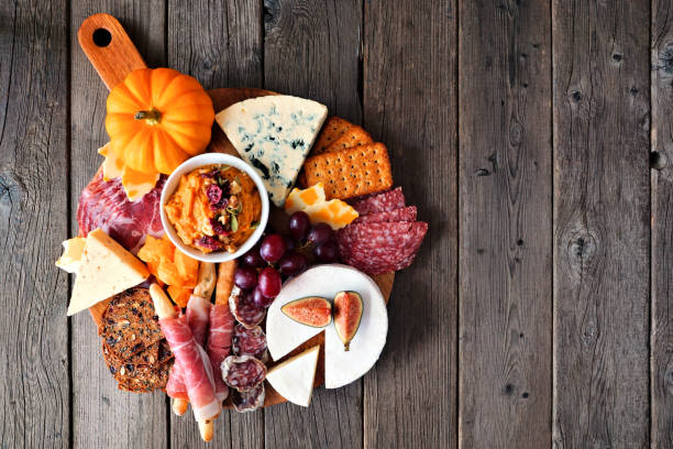 istock Fall charcuterie board, above view against a dark wood background 1276819149