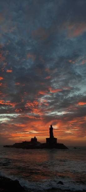 istock Portrait mode of sunrise and statue 1276820317
