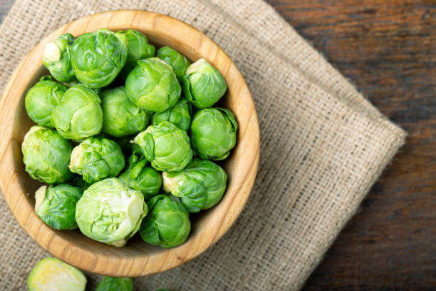 istock Brussels sprouts in a wooden bowl. Harvesting. 1276824183