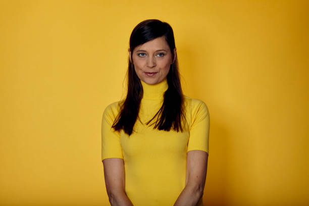 istock Studio shot of mature woman side view looking at camera 1276824392