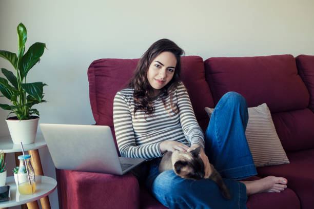 istock Young woman and her cat 1276825131