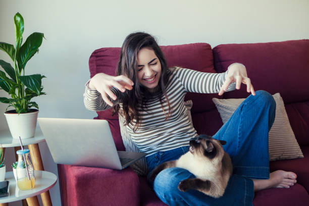 istock Young woman and her cat 1276825179