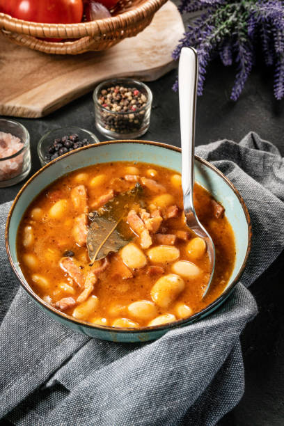 istock Beans with tomato sauce, bacon and sausage. 1276829714