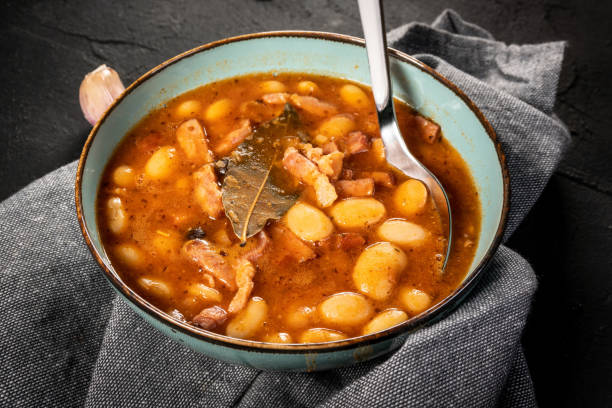istock Beans with tomato sauce, bacon and sausage. 1276829784