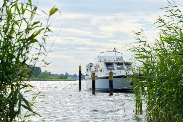 istock Yacht at a pier on the river Havel 1276831838