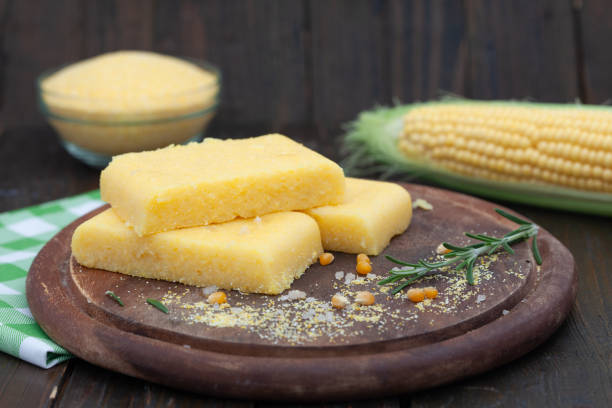 istock Corn polenta slices on wooden board 1276831981