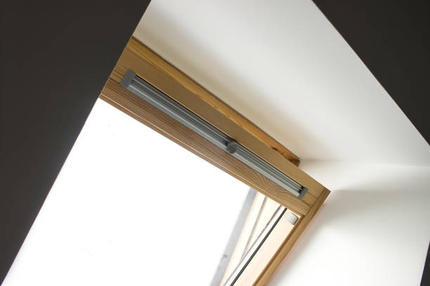 istock A modern open skylight mansard window in an attic room against sky. 1276833637