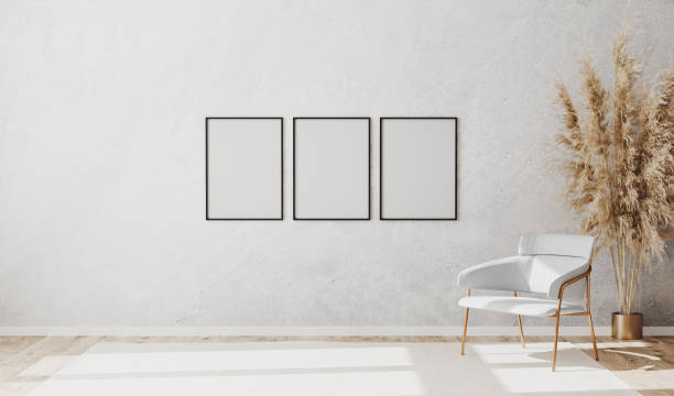 istock Blank poster frames in bright contemporary empty room interior with luxury white chair on wooden parquet floor and white decorative plaster wall, 3d rendering 1276834985