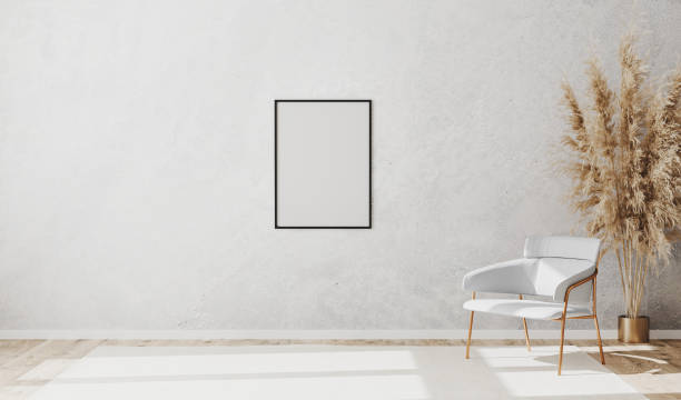 istock Blank poster frame in bright contemporary empty room interior with luxury white chair on wooden parquet floor and white decorative plaster wall, 3d rendering 1276834989