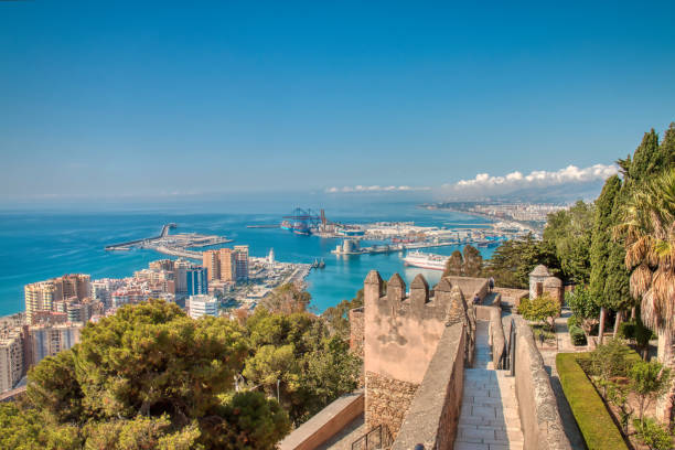 View from Gibralfaro Castle of the city of Malaga and its commercial port Malaga, Spain - June 26, 2019: View from Gibralfaro Castle of the city of Malaga and its commercial port, on the Costa del Sol, Spain málaga province photos stock pictures, royalty-free photos & images