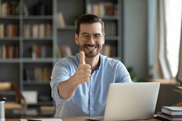 istock Portrait of smiling man recommend online work 1276837776
