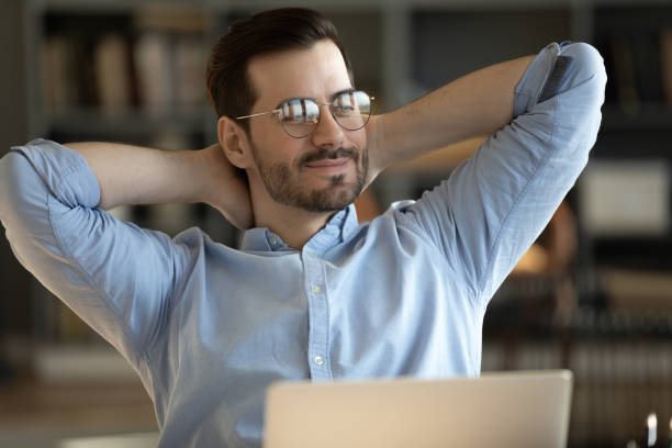 istock Calm Caucasian man relax at home office workplace dreaming 1276837788