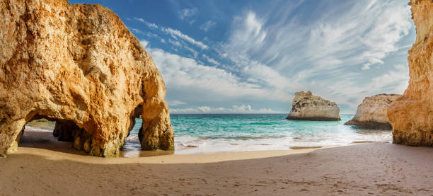 Amazing karst formations in Praia dos Tres Irmaos Amazing karst formations in Praia dos Tres Irmaos, famous beach in Algarve, Portugal alvor stock pictures, royalty-free photos & images
