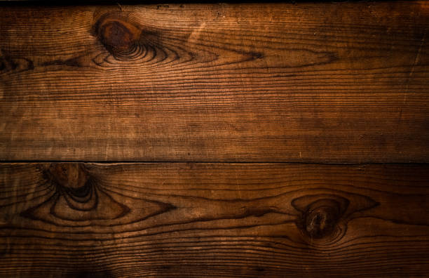 istock old dark brown pine wooden panel textured background 1276839899