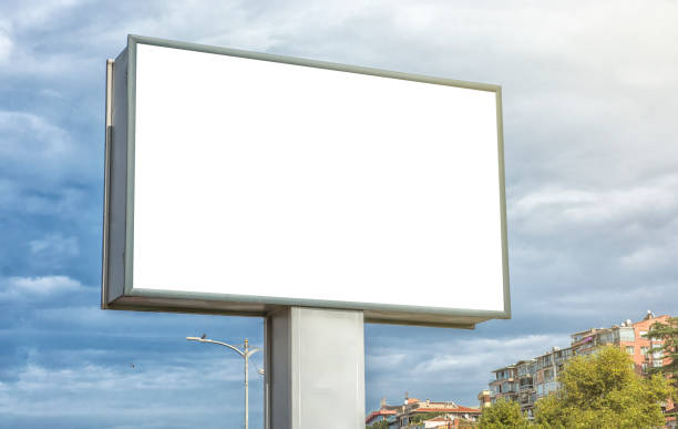 a big blank billboard for customisation in an urban stock photo - billboard symbol city street imagens e fotografias de stock
