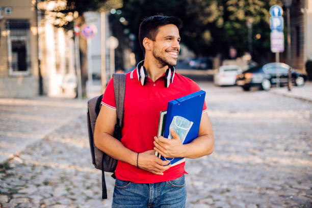 istock Portrait of a handsome student going on the college 1276861281