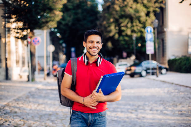 istock Portrait of a handsome student coming back from the university 1276861561