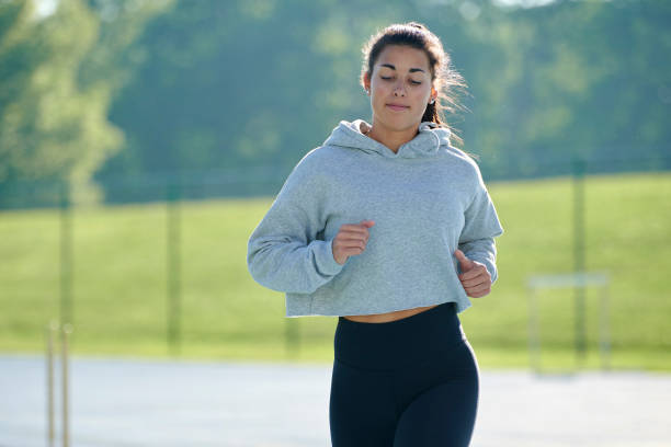 istock Beautiful and fit woman running 1276866172