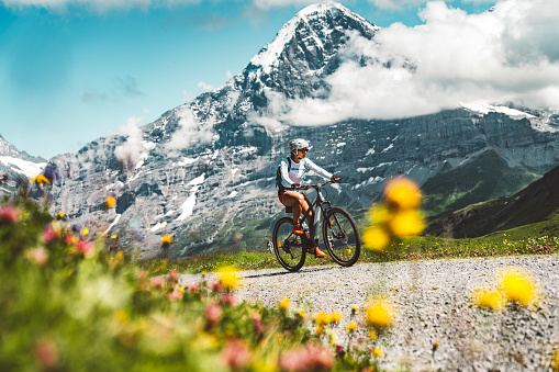 Woman riding a bike on mountain bike trail