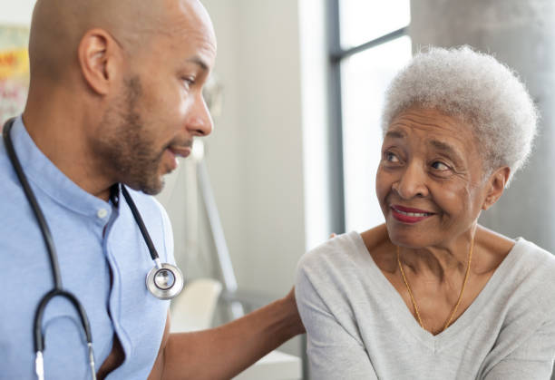 istock Male nurse visits elderly patient in residence 1276869083