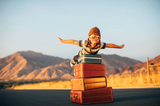 istock Young Boy Imagines Traveling 1276873403