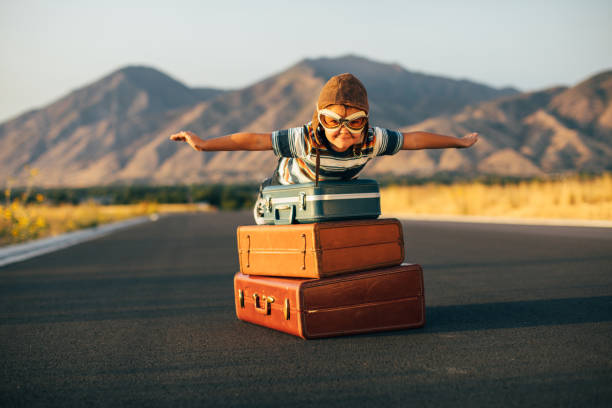istock Young Boy Imagines Traveling 1276873416