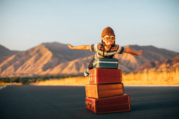 istock Young Boy Imagines Traveling 1276873443
