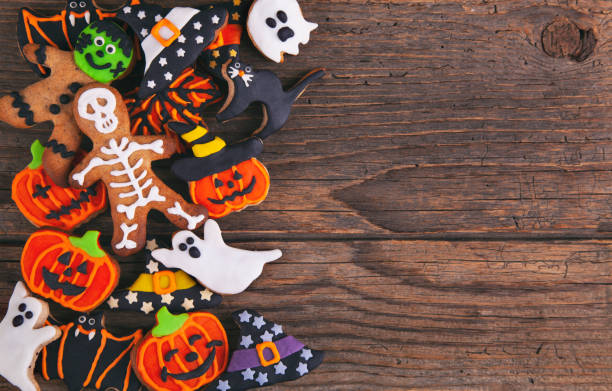 istock Halloween gingerbread cookies on wooden rustic background. 1276875428