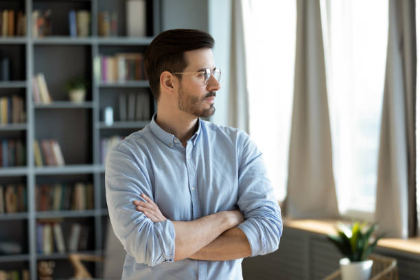 istock Pensive young Caucasian man look in distance thinking 1276876757