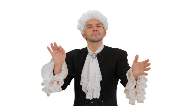 Medium shot. Front view. Man dressed like Mozart conducting expressively while looking at camera on white background. Professional shot in 4K resolution. 047. You can use it e.g. in your medical, commercial video, business, presentation, broadcast
