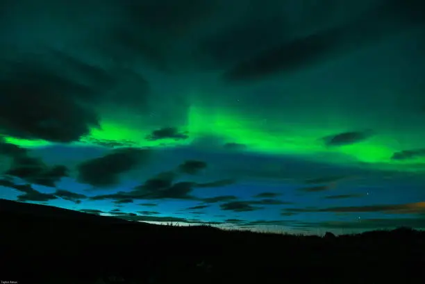 A still image of the Aurora Borealis or northern lights in Iceland.