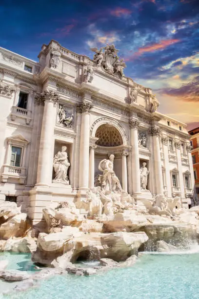 Trevi Fountain in Rome, Italy at sunset.