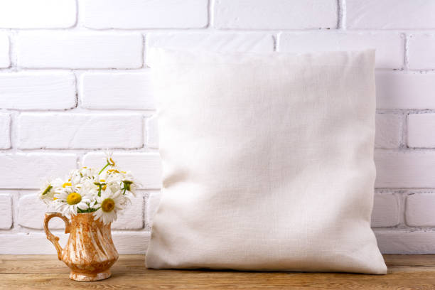 istock Pillow mockup with daisy in the golden pitcher 1276892170