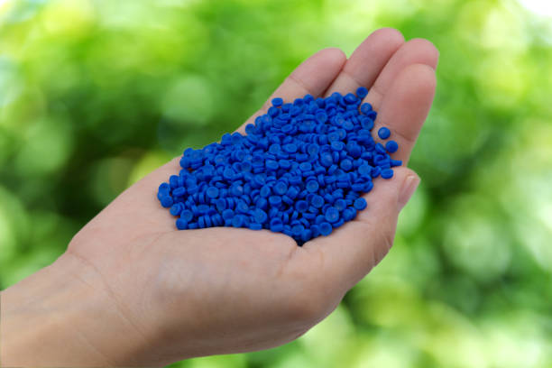 istock Close-up of plastic polymer granules. hand hold Polymer pellet on nature background. polymer plastic. compound polymer. 1276893570