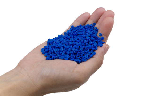 istock Close-up of plastic polymer granules. hand hold Polymer pellets. polymer plastic. compound polymer. 1276893574