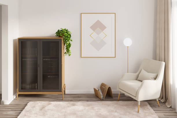 Bright modern room with a vertical poster between a bookcase, a cozy armchair with a lamp, curtains, fluffy carpet on a wooden floor. Front view.