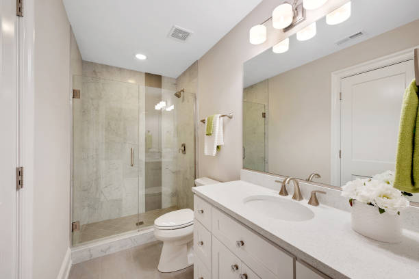 istock Bright bathroom with glass shower 1276897059