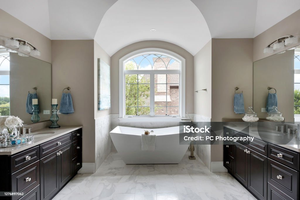 Gorgeous bathroom nook with free standing bathtub Spa-like elegance in master bath with set-up ready for pampering Free Standing Bath Stock Photo