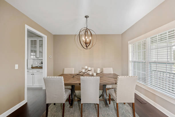 istock Lovely dining room with circular chandelier 1276901713