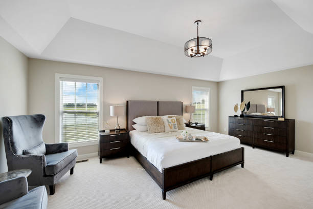 Wonderfully decorated bedroom with tray ceiling dark furniture in spacious master bedroom owners bedroom photos stock pictures, royalty-free photos & images