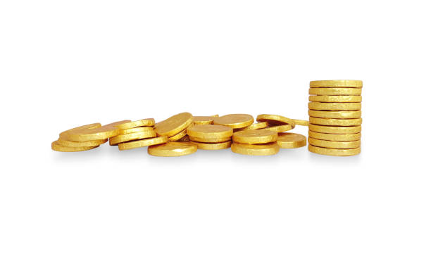 istock Golden coins stack and widespread coins isolated on white background. 1276905141