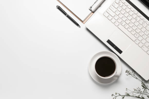 istock Top view coffee cup with notebook,pen or object for office supply concept on white background. 1276906247