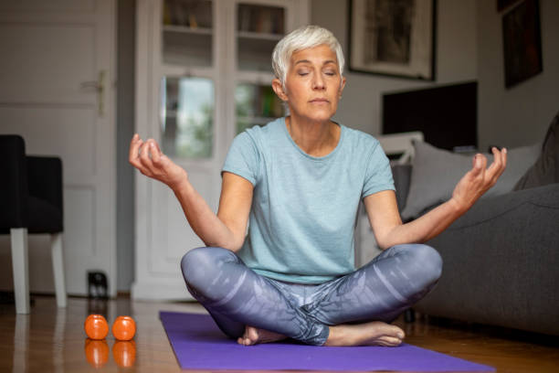 istock Senior mature woman doing yoga. 1276908280