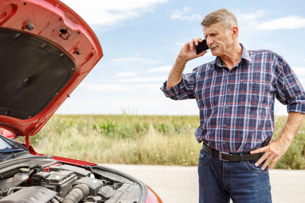 istock Angry man talking with road assistance via smart phone 1276909359