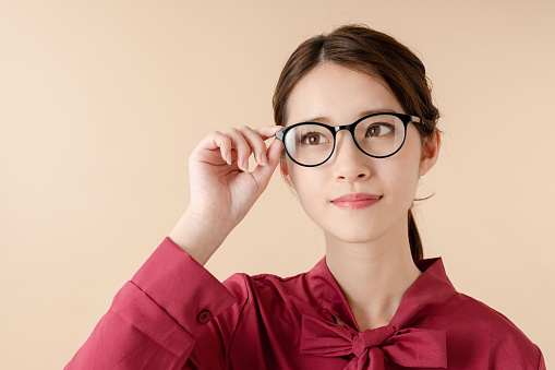 Young asian girl wearing eyeglasses.