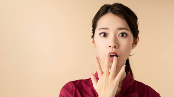 Surprised young woman. Surprised young woman. japanese woman stock pictures, royalty-free photos & images