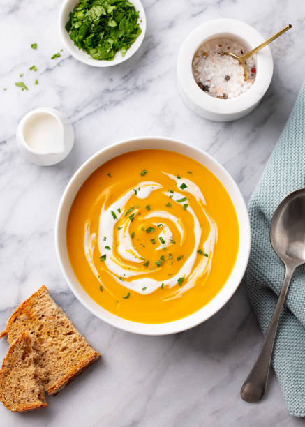 istock Pumpkin traditional soup with creamy silky texture. Marble background. Top view. 1276909501
