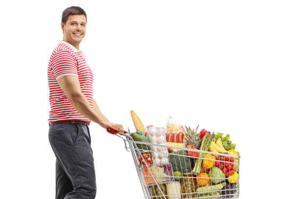 istock Man with a shopping cart smiling at the camera 1276910309