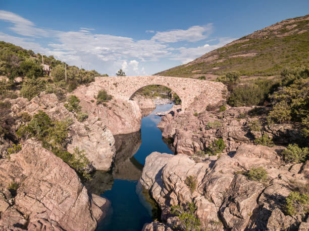 Ponte Vecchiu bridge over the crystal clear Fango river near Galeria in Corsica